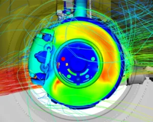 Computer-aided engineering (CAE) simulation of airflow around a brake assembly, visualized with colorful heat mapping and flow lines.