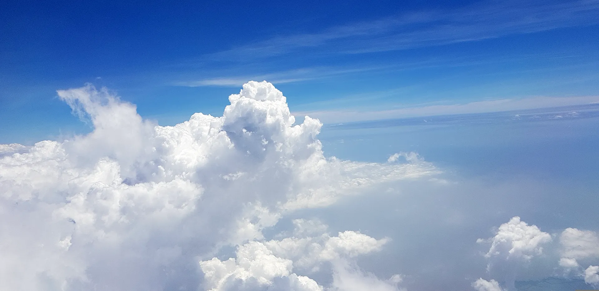 Blue sky with fluffy white clouds on a sunny day