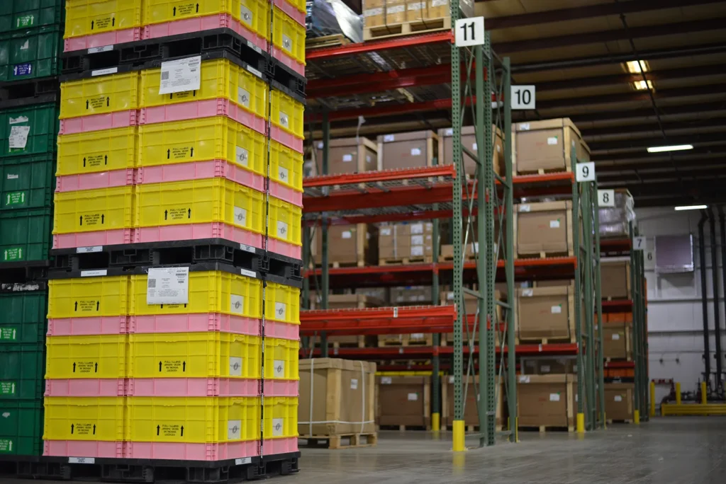 Stacked shipping crates inside Kinetyc’s warehouse in Wixom, Michigan, ready for manufacturing and assembly operations.