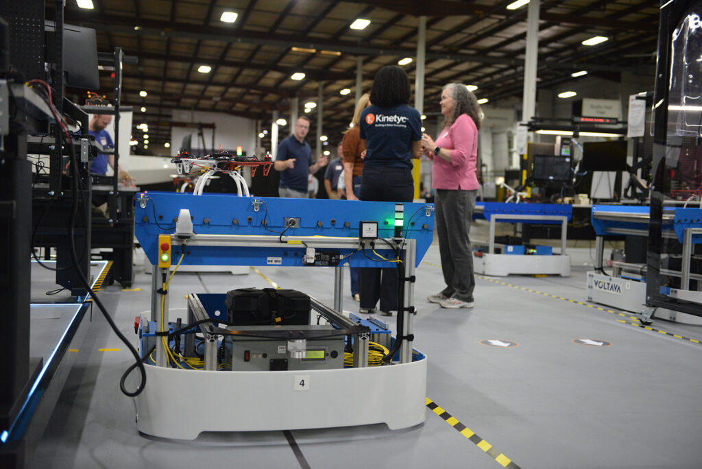 Guests explore the FLEXembly manufacturing system during the 2026 Kinetyc Open House in Wixom, Michigan.