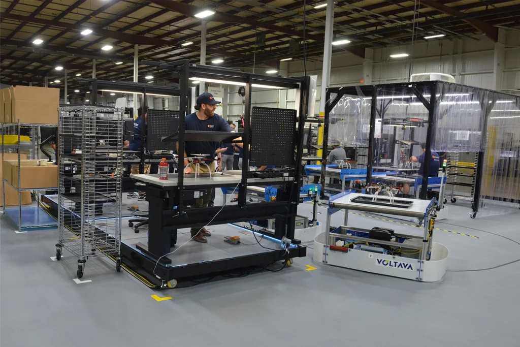 FLEXembly adaptive manufacturing system with reconfigurable workstations and an autonomous guided vehicle.